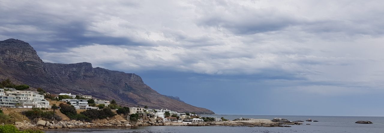 Coast and a mountain under cloud. This photograph heads the blog.